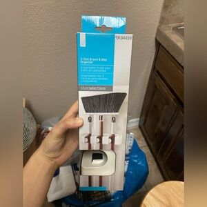 3-slot broom and mop organizer